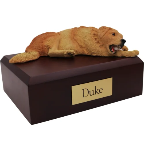 Laying Golden Retriever dog figurine on wood cremation urn