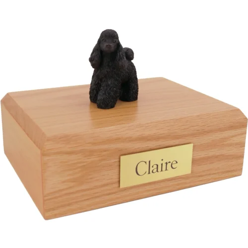 Black Poodle dog figurine on wood cremation urn