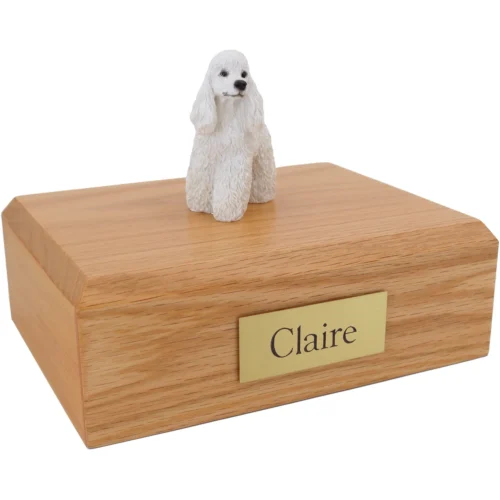 White Poodle dog figurine on wood cremation urn