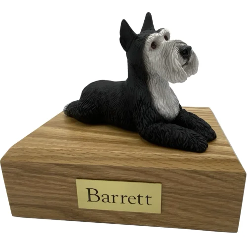 Black silver laying ears up Schnauzer dog figurine on wood cremation urn
