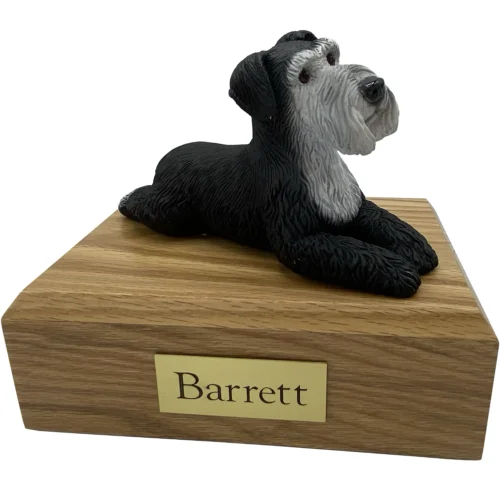 Black silver laying ears down Schnauzer dog figurine on wood cremation urn