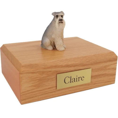 Gray ears down Schnauzer dog figurine on wood cremation urn