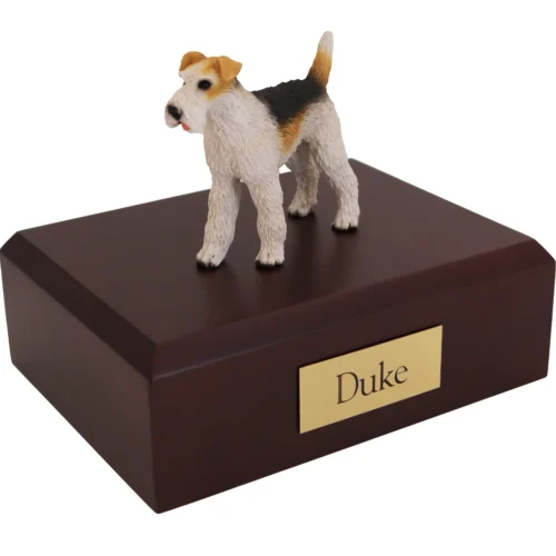 Standing wire haired Fox Terrier dog figurine on wood cremation urn