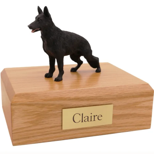 Standing black German Shepherd dog figurine on wood cremation urn