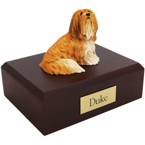 Sitting brown lhasa apso dog figurine on wood cremation urn