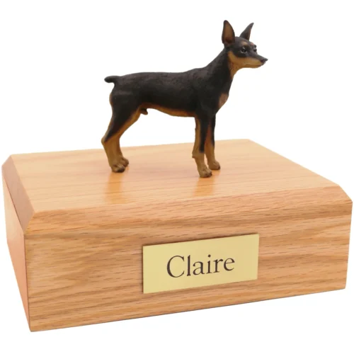Standing ears up brown black and tan miniature doberman pinscher dog figurine on wood cremation urn