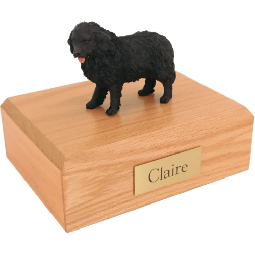 Standing black newfoundland dog figurine on wood cremation urn