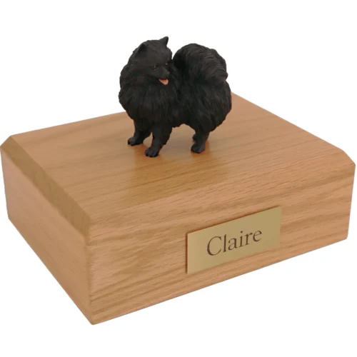 Standing Black Pomeranian dog figurine on wood cremation urn
