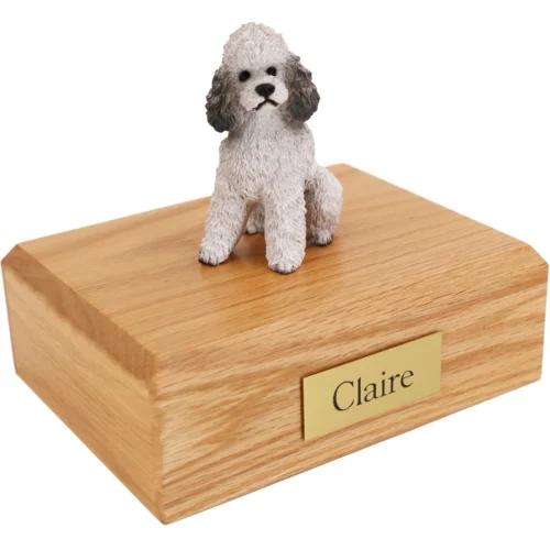 Gray Sport Cut Poodle dog figurine on wood cremation urn