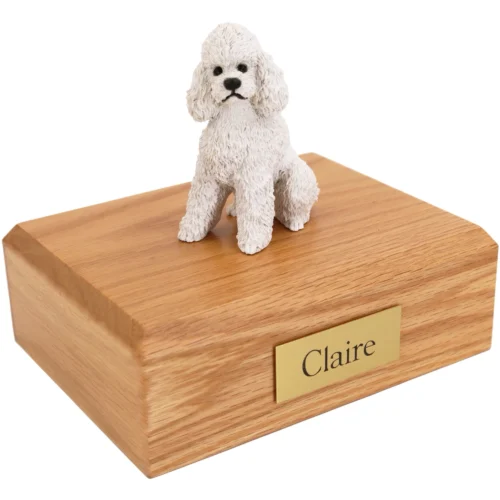 White Sport Cut Poodle dog figurine on wood cremation urn