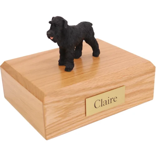 Standing ears down black Schnauzer dog figurine on wood cremation urn