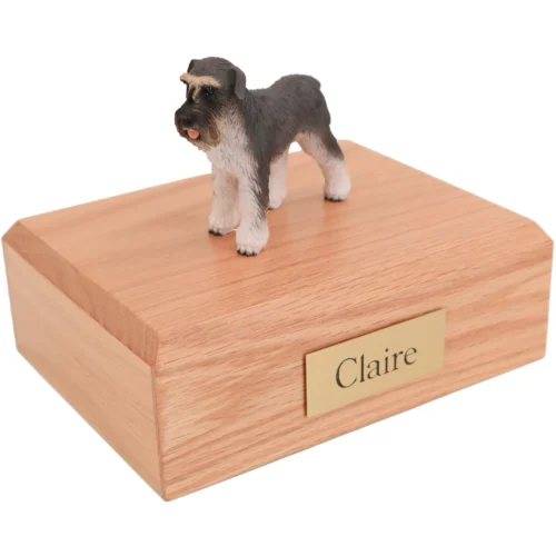 Standing ears down gray Schnauzer dog figurine on wood cremation urn