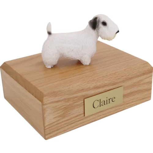 Sealyham Terrier dog figurine on wood cremation urn