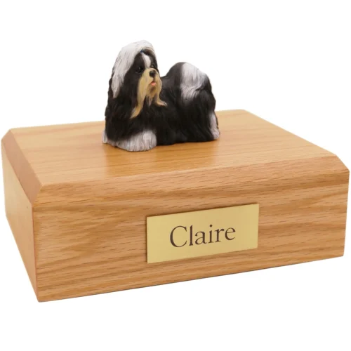 Standing black and white shih tzu dog figurine on wood cremation urn