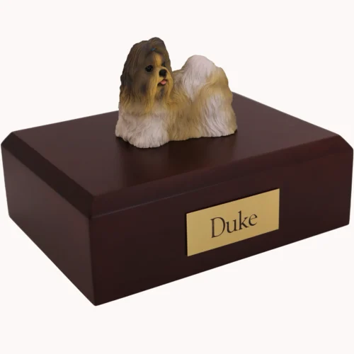 Standing gray and white shih tzu dog figurine on wood cremation urn