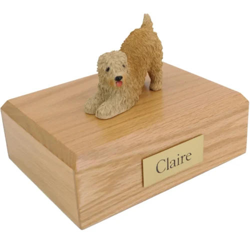 Soft coated wheaten dog figurine on wood cremation urn