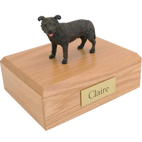 Standing staffordshire bull terrier dog figurine on wood cremation urn