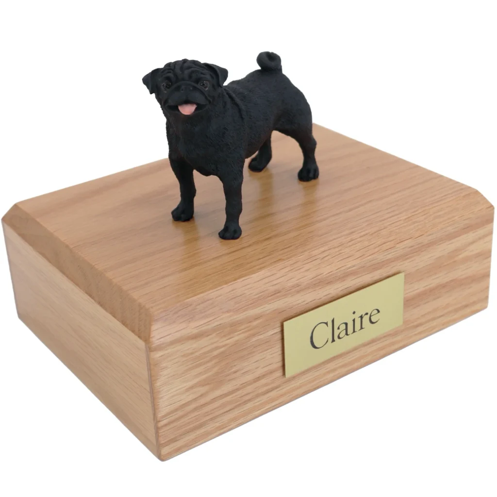 Standing black pug dog figurine on wood cremation urn