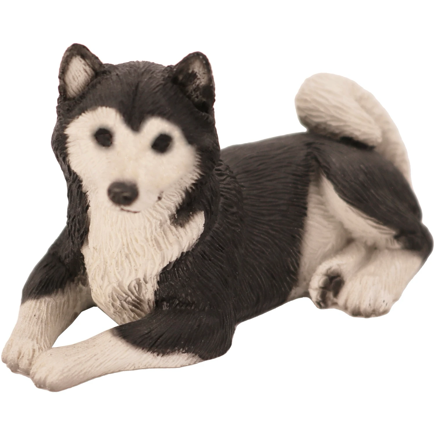 Laying black and white Husky dog figurine for cremation urn, front view