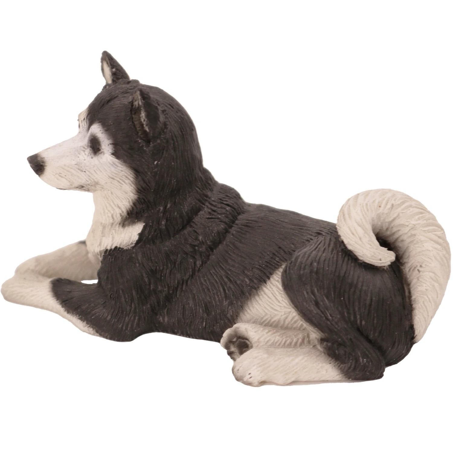 Laying black and white Husky dog figurine for cremation urn, side view