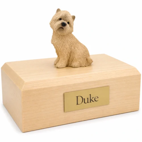 Memorial cremation urn with sitting Cairn Terrier dog figurine, maple finish