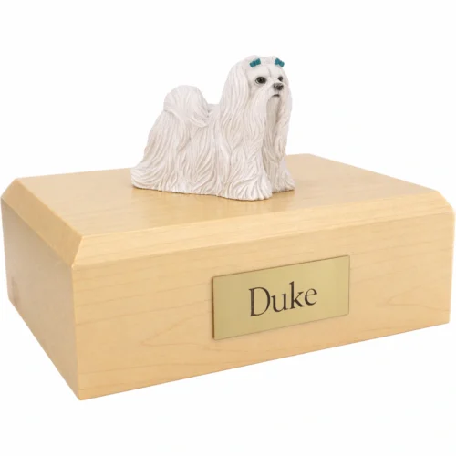 Memorial cremation urn with standing Maltese dog figurine, maple finish