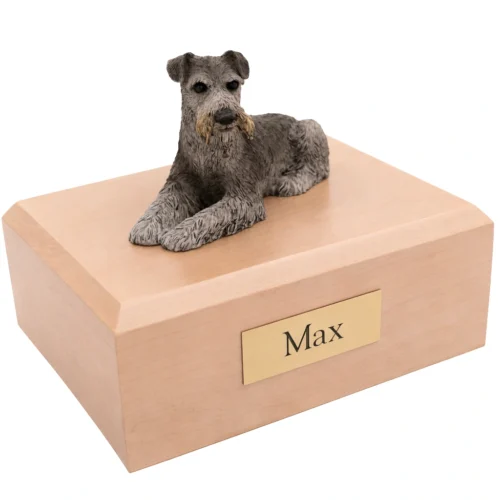 Memorial cremation urn with laying ears down Schnauzer dog figurine, maple finish
