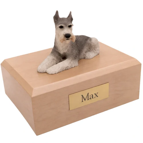 Memorial cremation urn with laying ears up tari Schnauzer dog figurine, maple finish