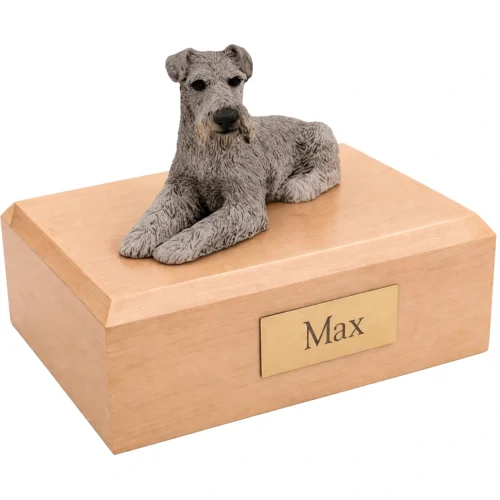 Memorial cremation urn with laying ears down silver Schnauzer dog figurine, maple finish