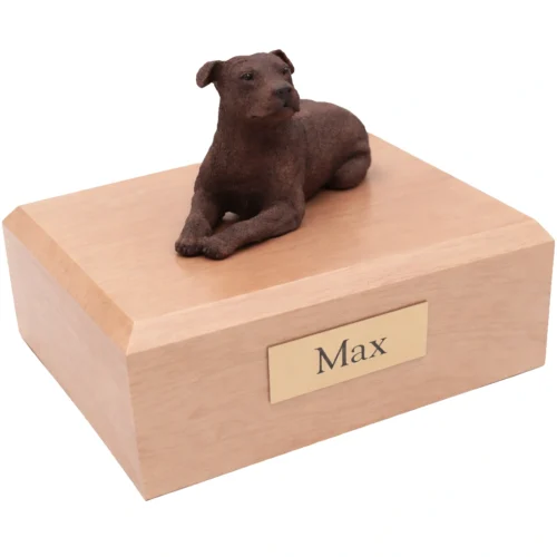 Memorial cremation urn with laying Staffordshire Terrier dog figurine, maple finish