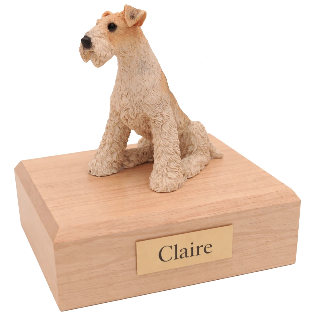 Memorial cremation urn with sitting Fox Terrier dog figurine, maple finish