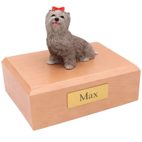 Memorial cremation urn with sitting gray Yorkshire Terrier dog figurine, maple finish
