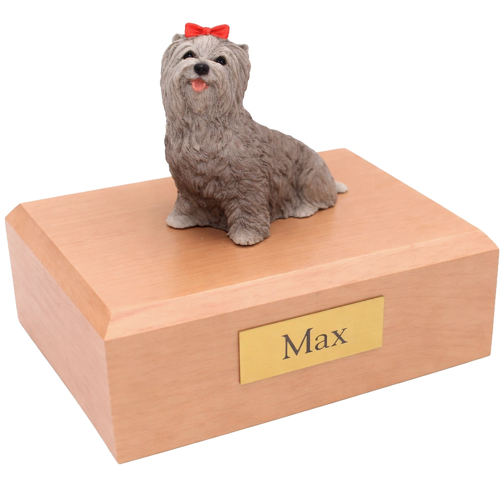 Memorial cremation urn with sitting gray Yorkshire Terrier dog figurine, maple finish
