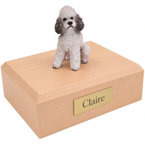 Memorial cremation urn with sitting white and gray Poodle dog figurine, maple finish