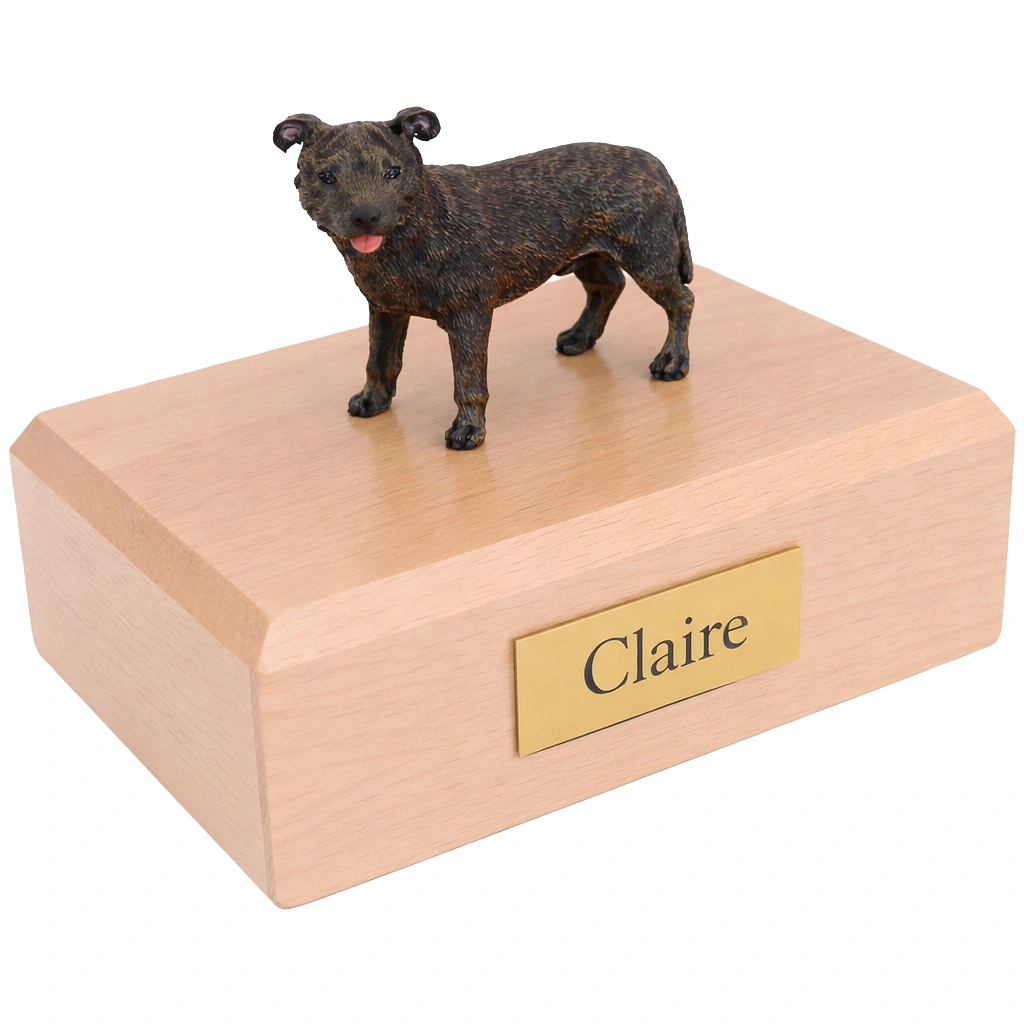 Memorial cremation urn with standing Staffordshire Bull Terrier dog figurine, maple finish