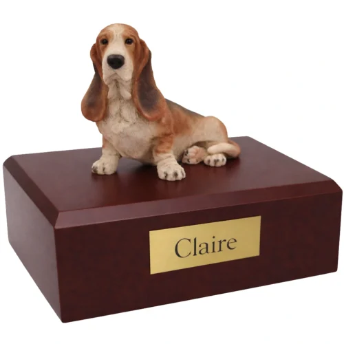 Memorial cremation urn with sitting Basset Hound dog figurine, walnut finish