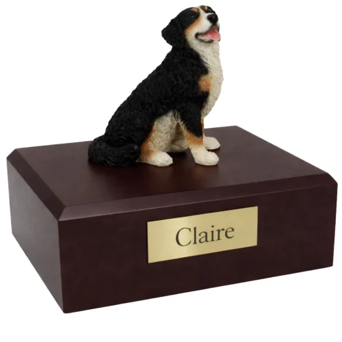 Memorial cremation urn with laying Bernese Mountain Dog figurine, walnut finish