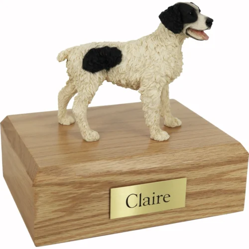 Memorial cremation oak finish urn with standing black and white Brittany dog figurine