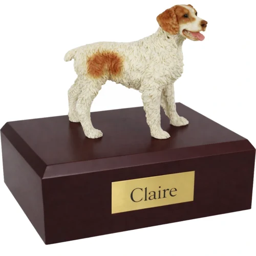 Memorial cremation urn with standing brown and white Brittany Spaniel dog figurine, walnut finish