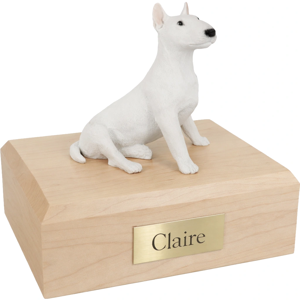 Memorial cremation urn with sitting white Bull Terrier dog figurine, maple finish