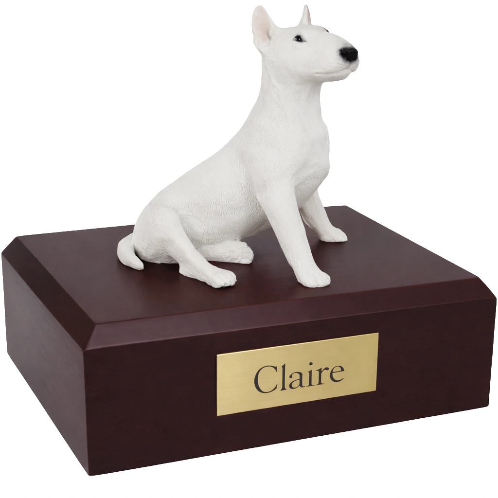 Memorial cremation urn with sitting white Bull Terrier dog figurine, walnut finish