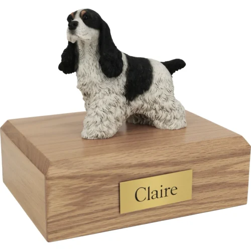 Memorial cremation urn with black and white Cocker Spaniel dog figurine, oak finish