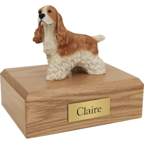 Memorial cremation urn with tan and white Cocker Spaniel dog figurine, oak finish