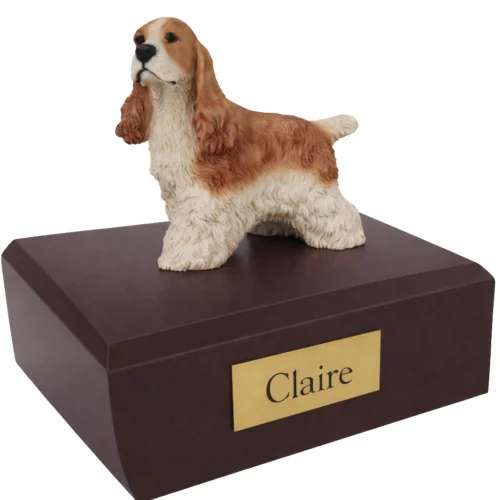 Memorial cremation urn with standing tan and white Cocker Spaniel dog figurine, walnut finish