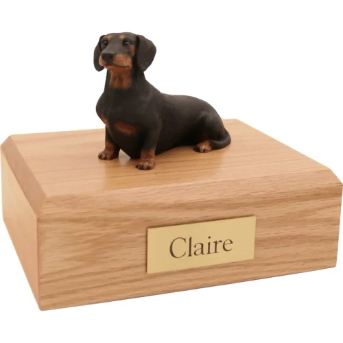 Memorial cremation oak finish urn with sitting black and red Dachshund dog figurine