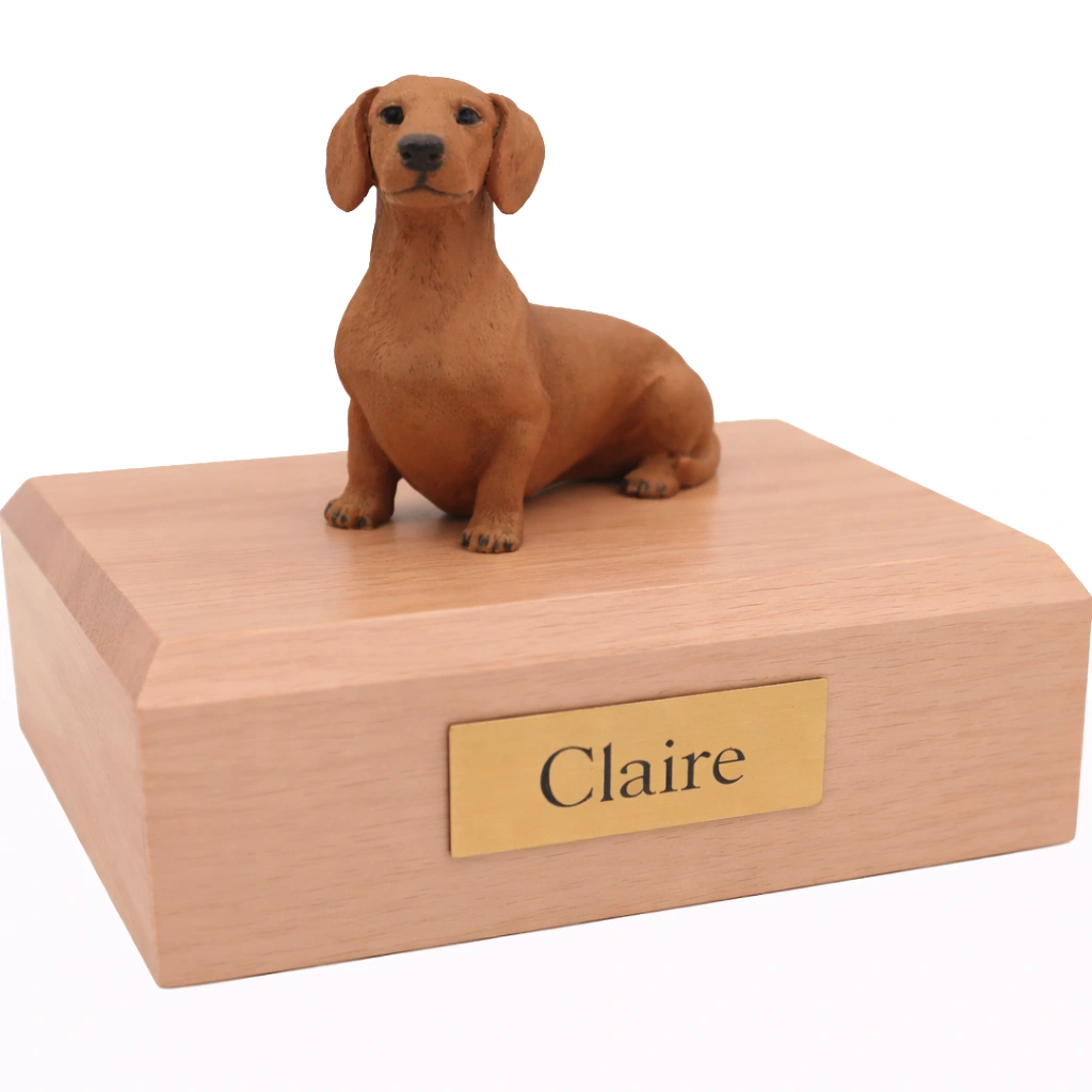 Memorial cremation urn with sitting red Dachshund dog figurine, maple finish