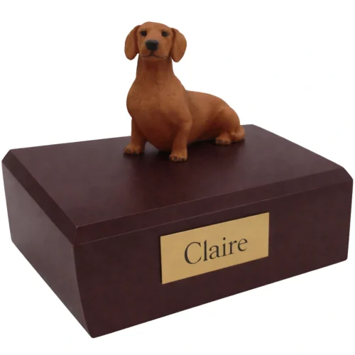 Memorial cremation urn with sitting red Dachshund dog figurine, walnut finish