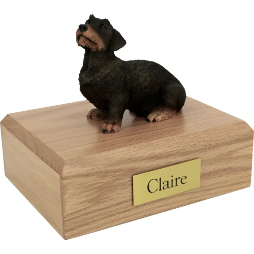 Memorial cremation urn with long haired Dachshund dog figurine, oak finish