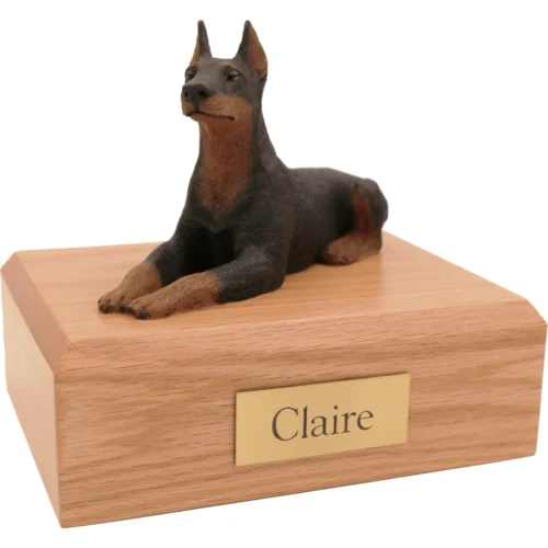 Memorial cremation oak finish urn with laying black and tan ears up Doberman Pinscher dog figurine
