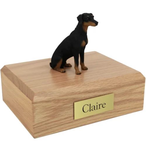 Memorial cremation urn with sitting Doberman Pinscher dog figurine, oak finish
